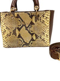 Bolso Tipo kelly mod. Viena Pitón Coñac