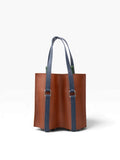 Bolsa porta botellas doble mosvartimx de cuero genuino color café con asas azules y remaches metálicos