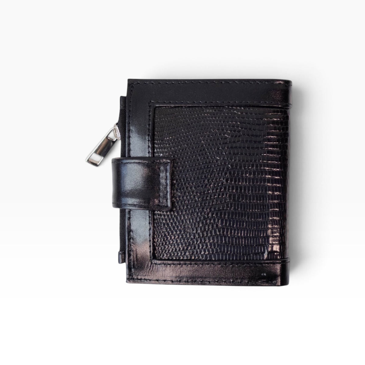 Cartera para dama mosvartimx modelo Bolivia en piel negra con textura exótica y cierre de broche tipo lengua