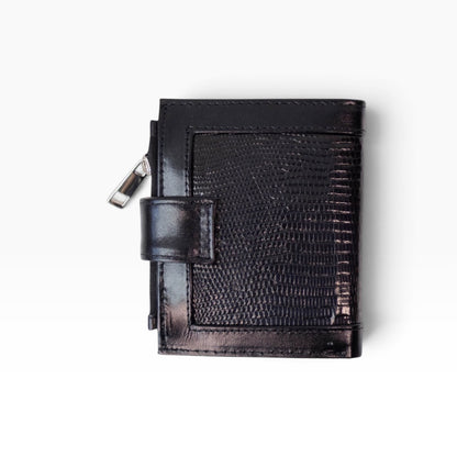 Cartera para dama mosvartimx modelo Bolivia en piel negra con textura exótica y cierre de broche tipo lengua